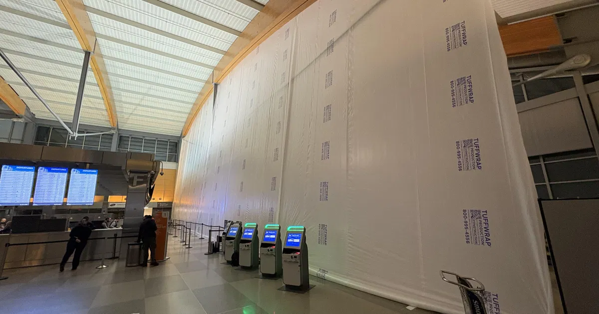 Wall going up in Terminal 2; travelers see evidence of RDU expansion project
